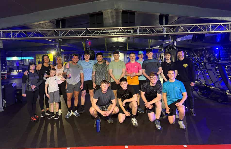 Group gathered at a boxing gym Group gathered at a boxing gym